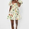 Exclusive Ivory Floral Caramelo Mini Dress